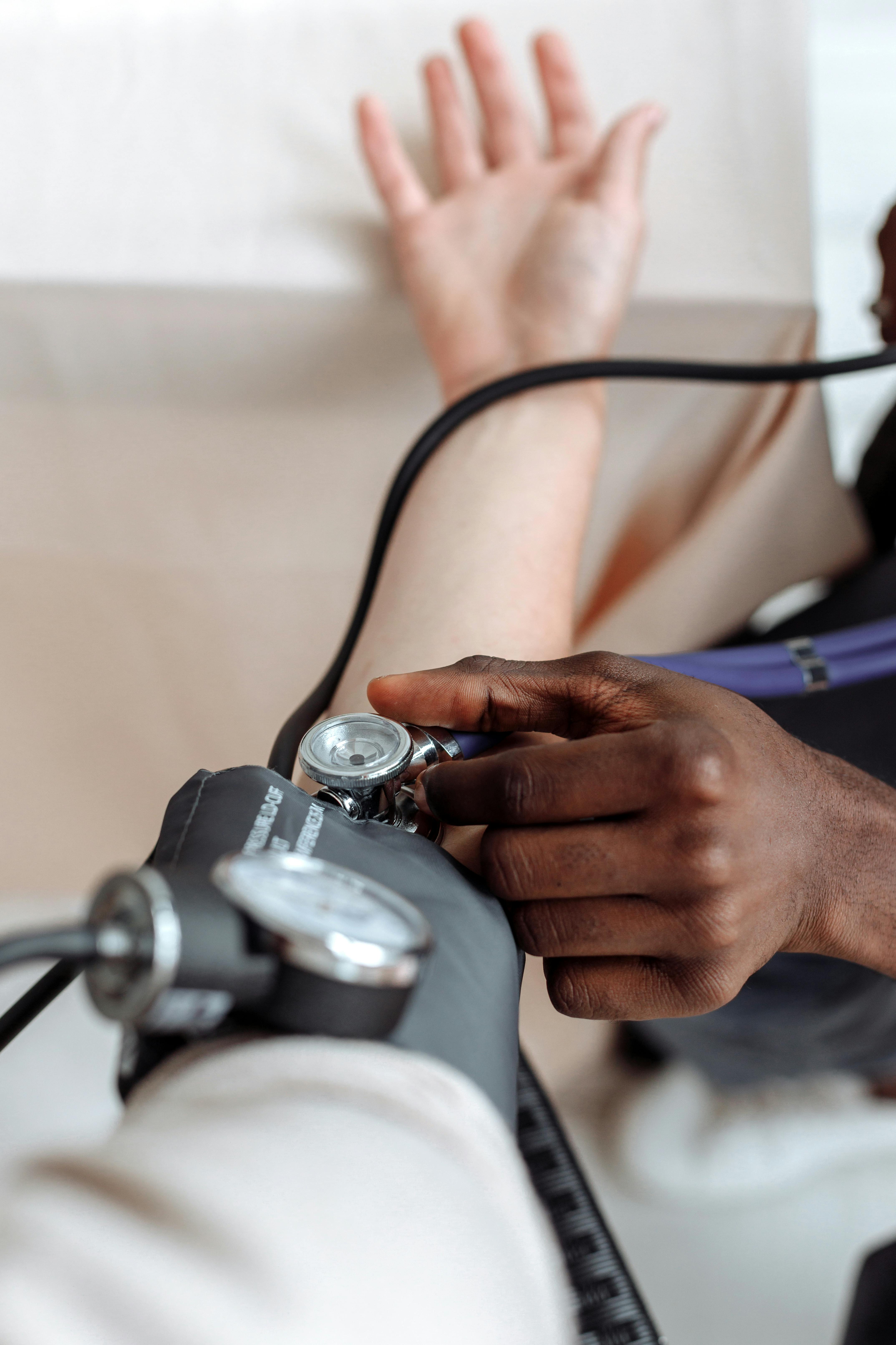 Photo by Thirdman  : https://www.pexels.com/photo/a-person-checking-the-blood-pressure-of-the-patient-5327865/