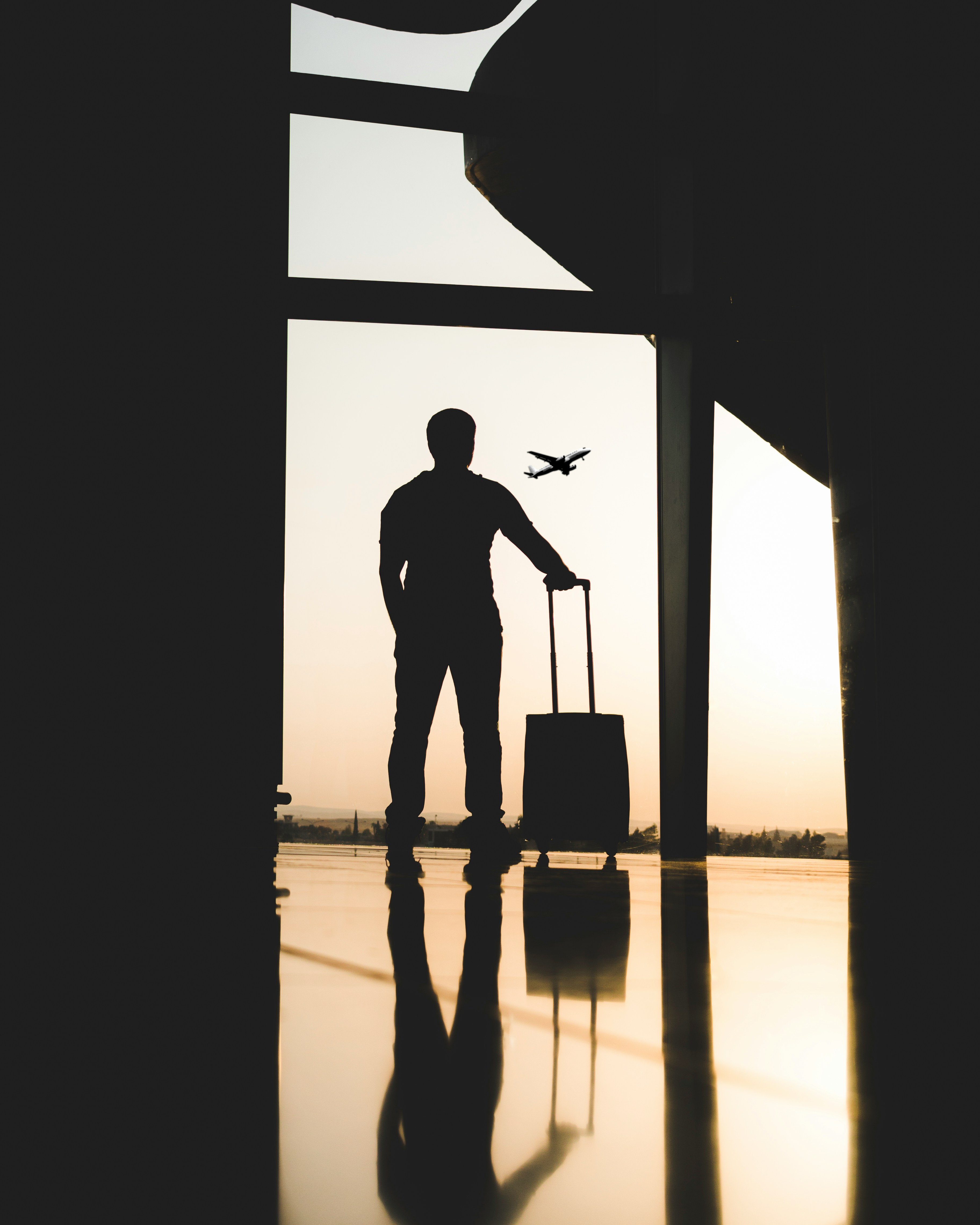 Photo by <a href="https://unsplash.com/@yousefalfuhigi?utm_source=unsplash&utm_medium=referral&utm_content=creditCopyText">yousef alfuhigi</a> on <a href="https://unsplash.com/photos/silhouette-of-man-holding-luggage-inside-airport-bMIlyKZHKMY?utm_source=unsplash&utm_medium=referral&utm_content=creditCopyText">Unsplash</a>